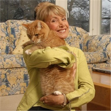 Jan leaming holding a ginger cat