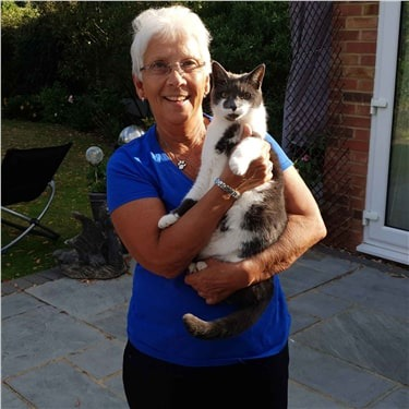 Cats Protection volunteer holding a cat