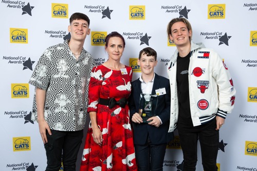 four people stood in front of National Cat Awards backdrop