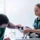 vets exam black white cat