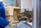 brown tabby cat going into a cat carrier