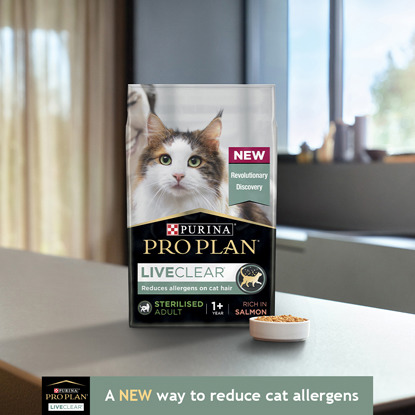 Bag of Purina Pro Plan LiveClear cat food on kitchen counter next to bowl of cat food
