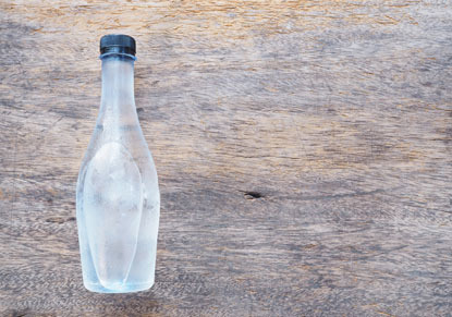bottle containing frozen water