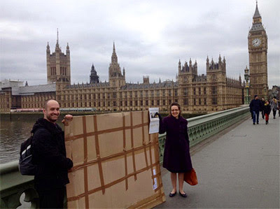 Carrying a disguised kitten cardboard cut-out across Westminster Bridge