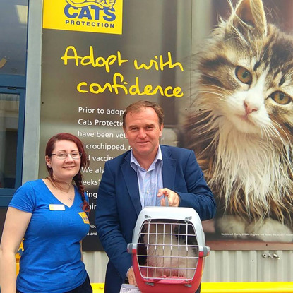 George Eustice MP leaving the Mitcham Homing Centre with adopted cat Gus in cat carrier