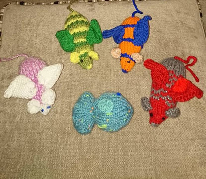 4 knitted catnip mice toys and 1 knitted fish catnip toy for cats