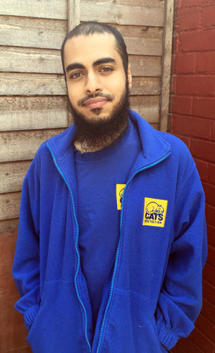 young man wearing blue Cats Protection fleece and t-shirt