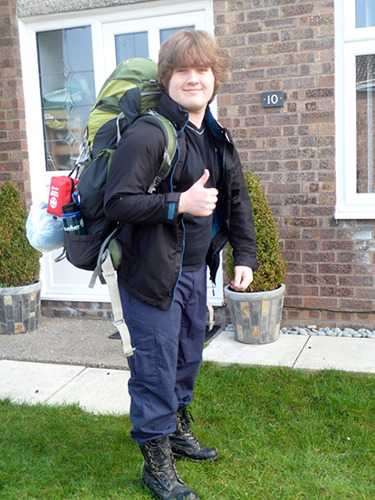 teenage boy wearing backpack for hiking