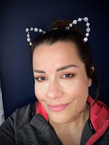 Brunette woman wearing diamond cat ears headband