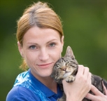 Volunteer holding a cat