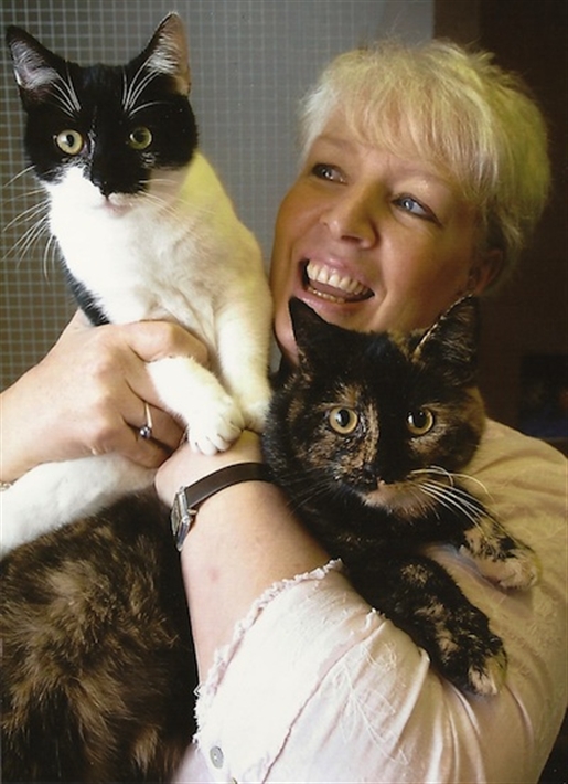 Woman holding foster cats
